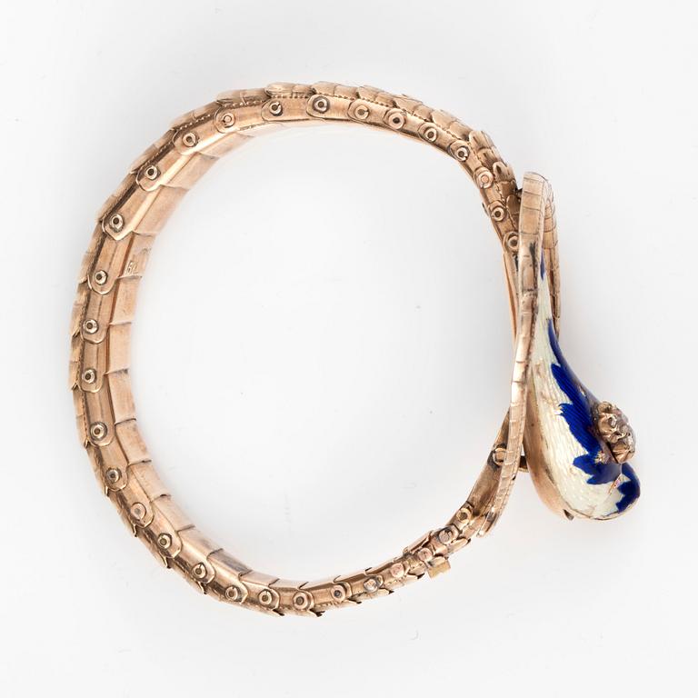 A bracelet in the shape of a serpent. Enameled head set with two diamonds. Russian marks, possiby Moscow 1857.