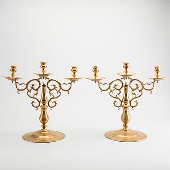 A pair of brass candelabras Gusum around 1900.