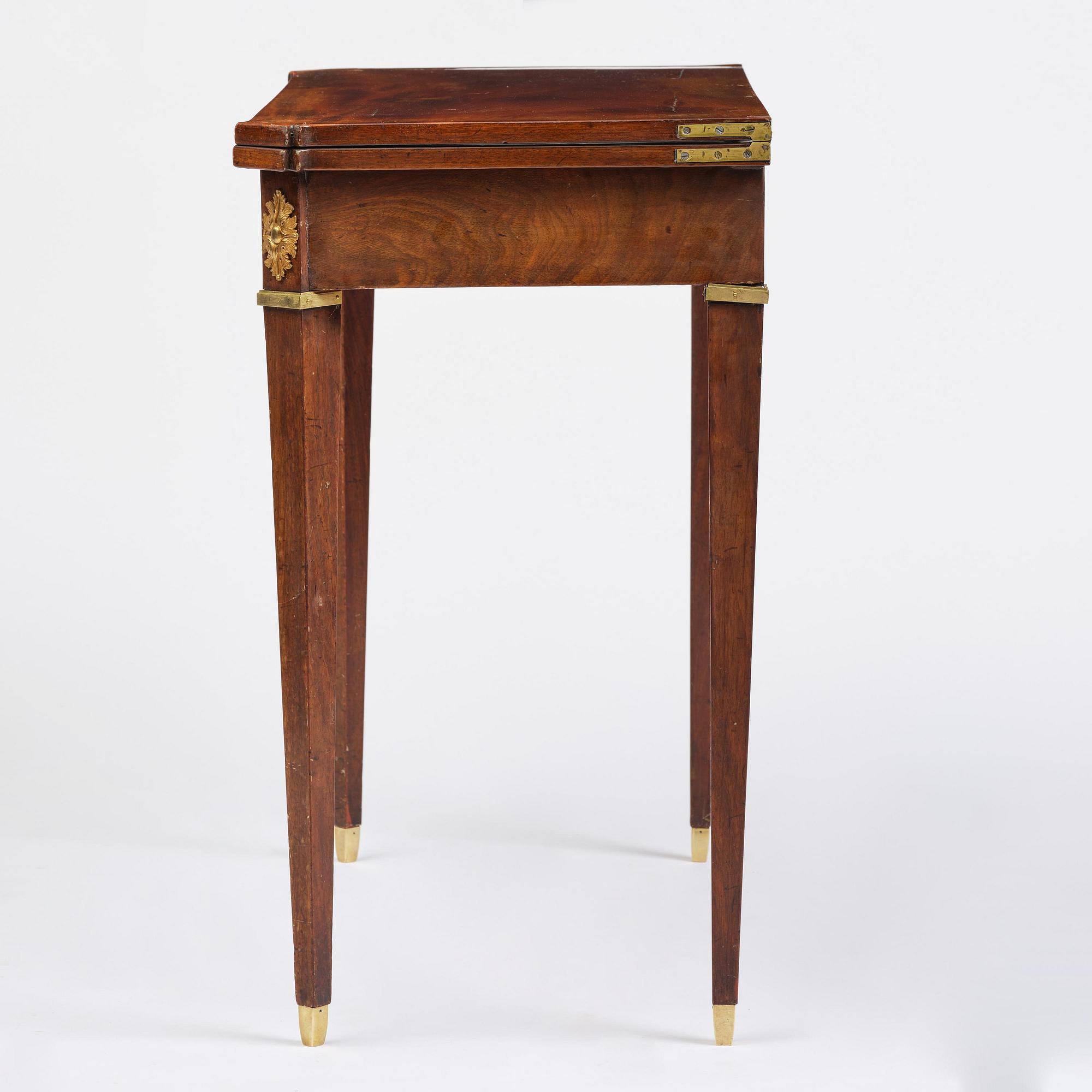 A Gustavian 'concertina action' mahogany games table by Georg Haupt (master in Stockholm 1770-84).
