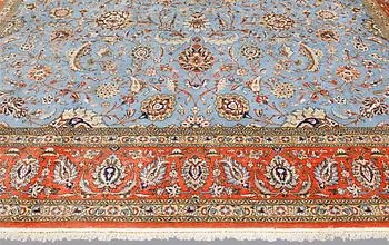 A Ghom carpet, part silk, approx. 480 x 350 cm.