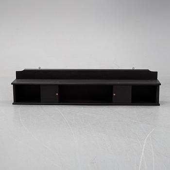 A painted wall shelf, early 20th Century.