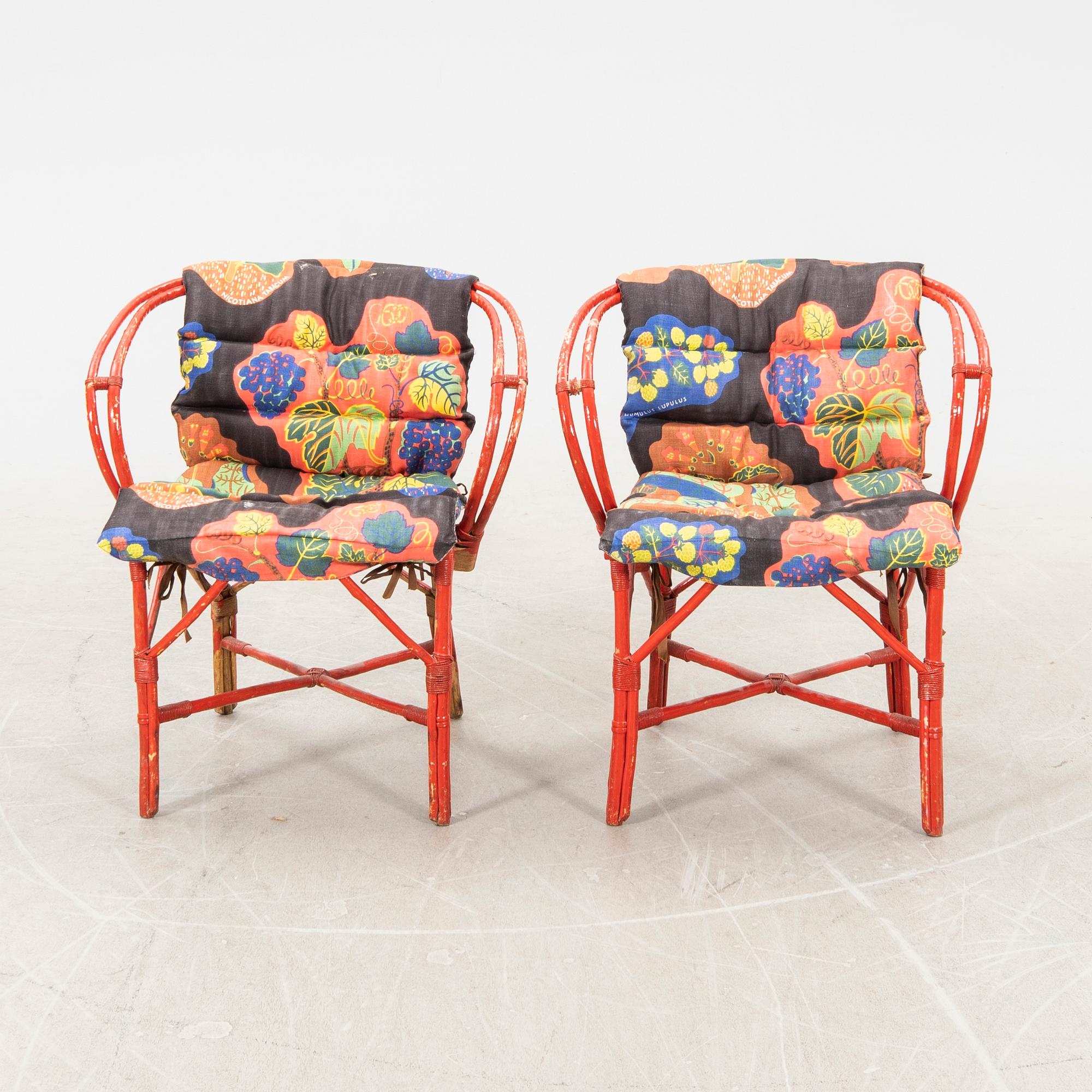A pair of painted rattan armchairs possibly by Svenskt Tenn.