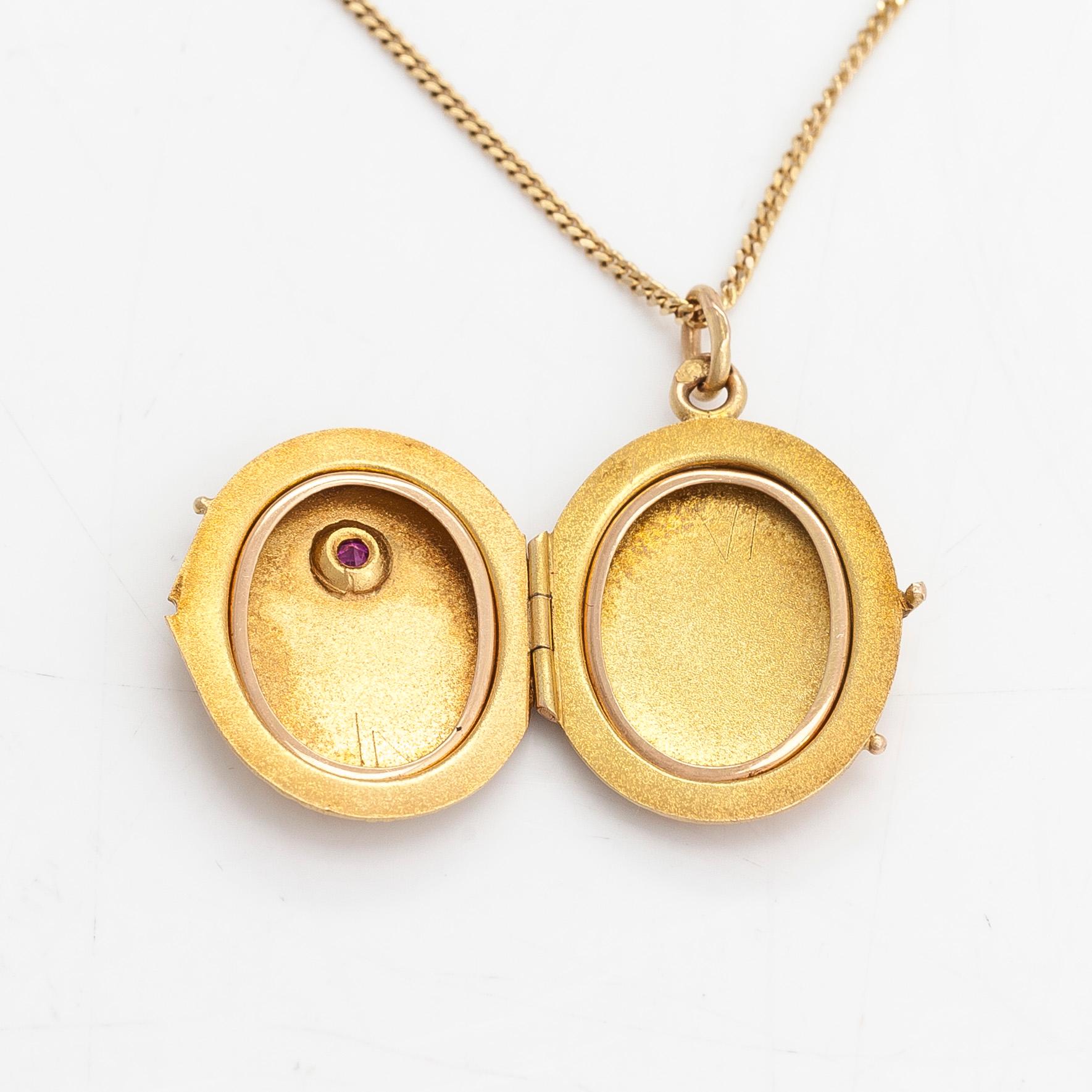 A 14K gold necklace with a locket and a syntetic ruby. Soviet Union.
