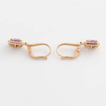 Earrings with pink sapphires and diamonds.