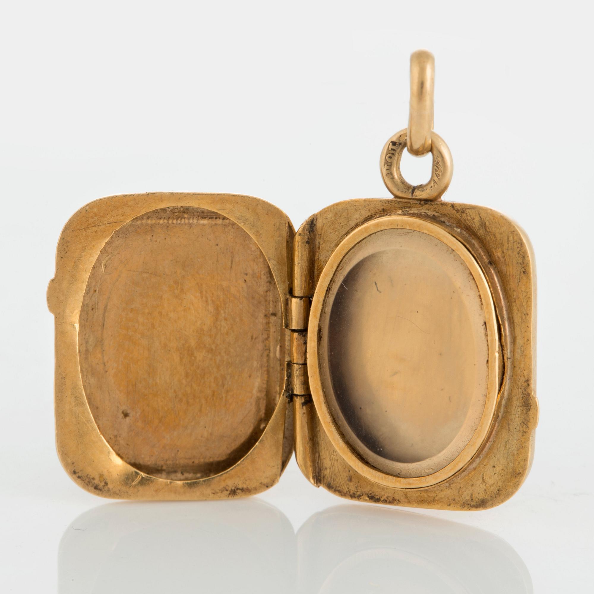 MEDALJONG, 18K guld och lapis lazuli.