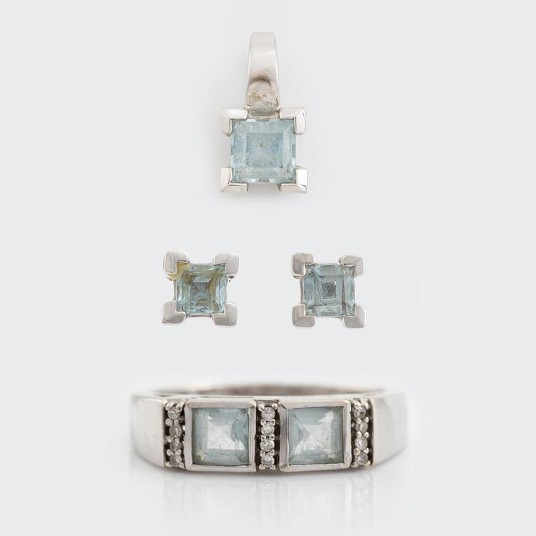 Ring, pendant, and a pair of earrings, 18K white gold with topaz and small diamonds.