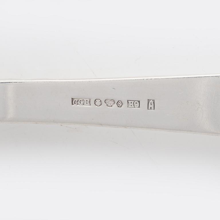 Nine pieces of silver cutlery.