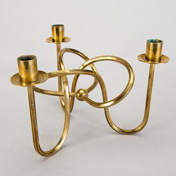 A Josef Frank brass 'Vänskapsknuten' candelabrum from Svenskt Tenn.