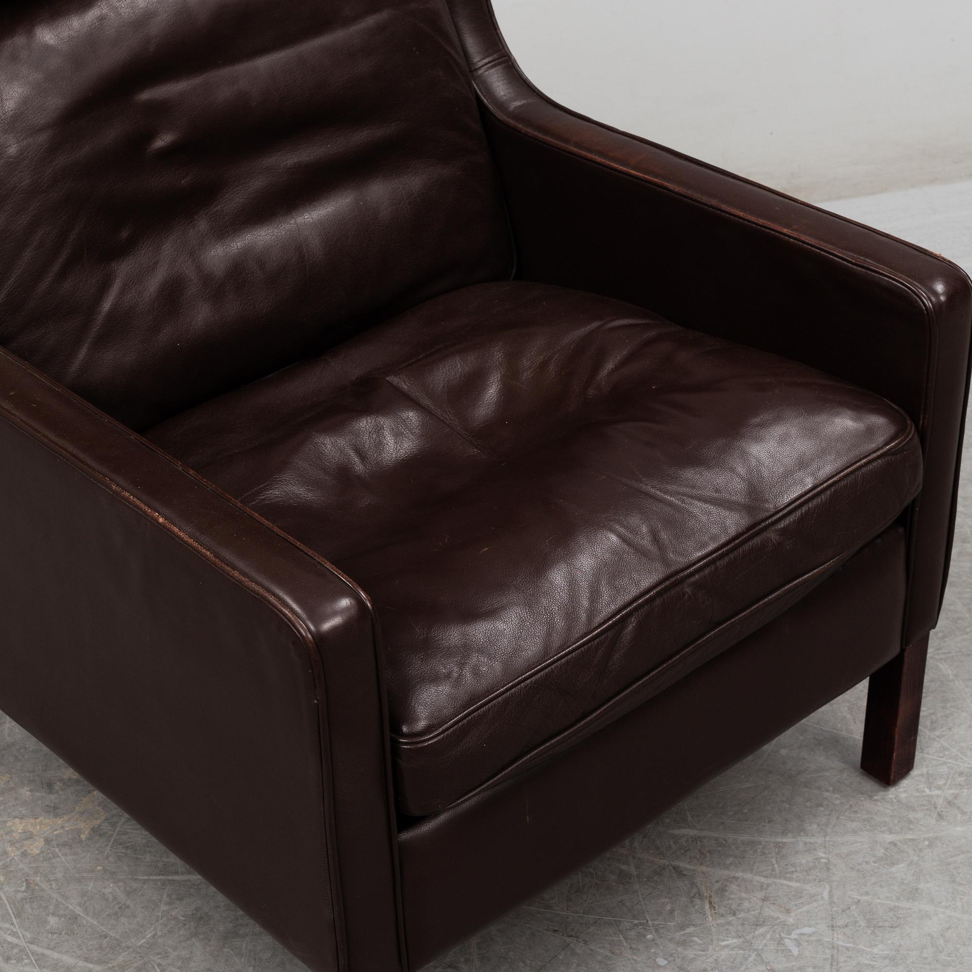 A leather covered 'Lulu' wing-chair from Stouby, Denmark, second half of the 20th Century.