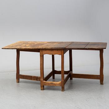 An 18th century gateleg table.