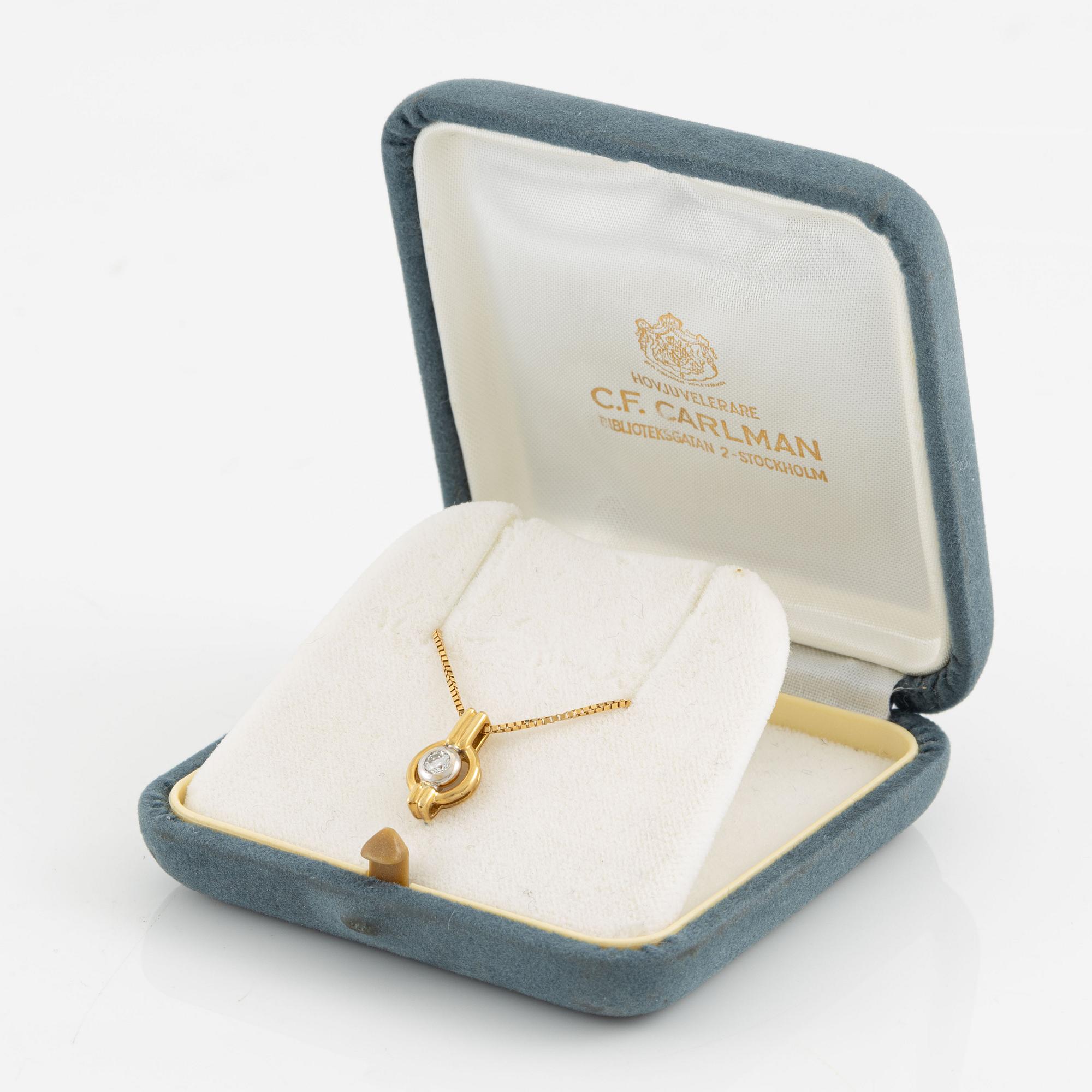 Hängsmycke, 18K guld med briljantslipad diamant.