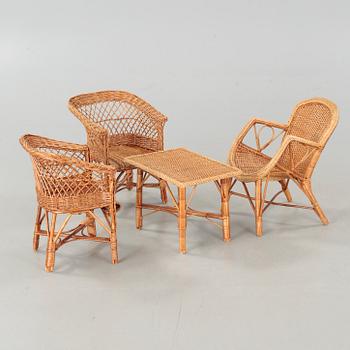 Four childrens rattan furniture from around year 1900 and from the 20th century.