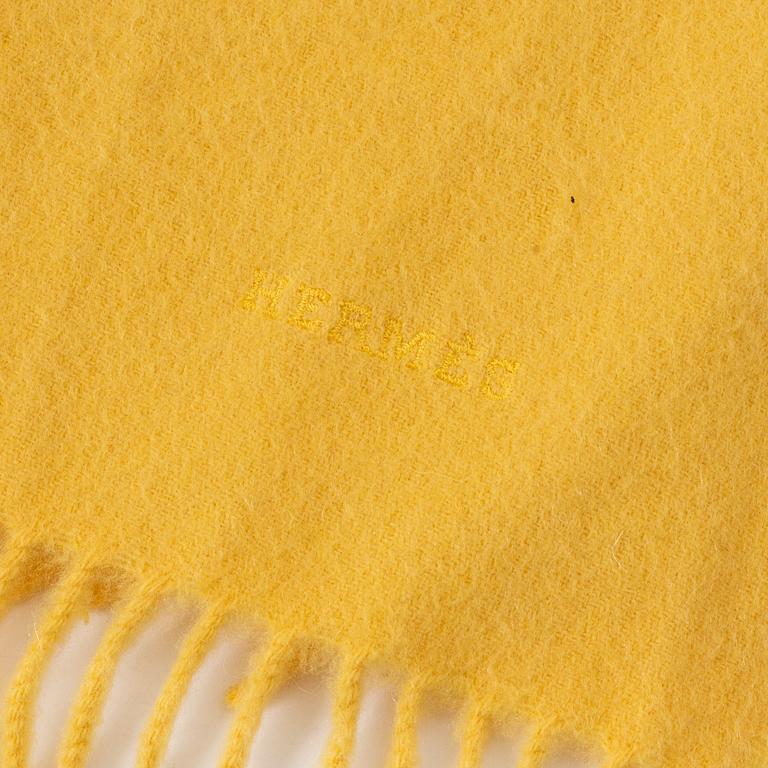 Hermès, a yellow cashmere scarf.