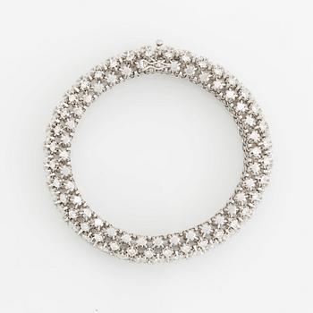 A platinum bracelet set with round brilliant-cut diamonds.