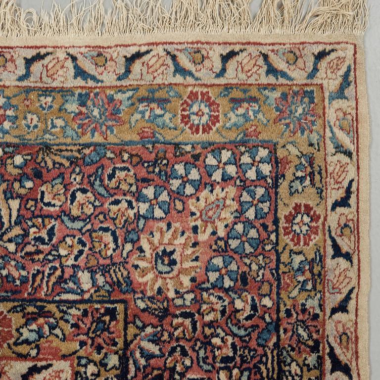 A semi-antique/old Kerman carpet, around 361 x 264 cm.