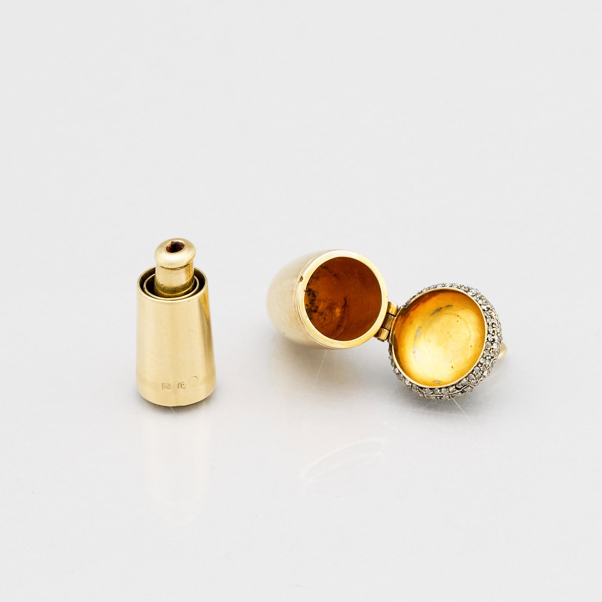 A jeweled gold pendant locker, with a cigarette holder, St. Petersburg 1908-1917.