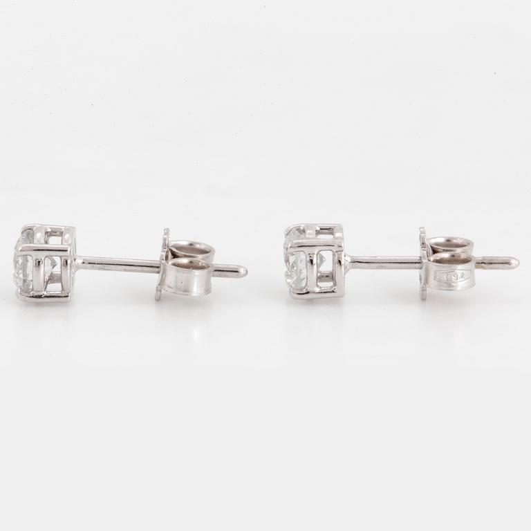 Brilliant-cut diamond stud earrings.