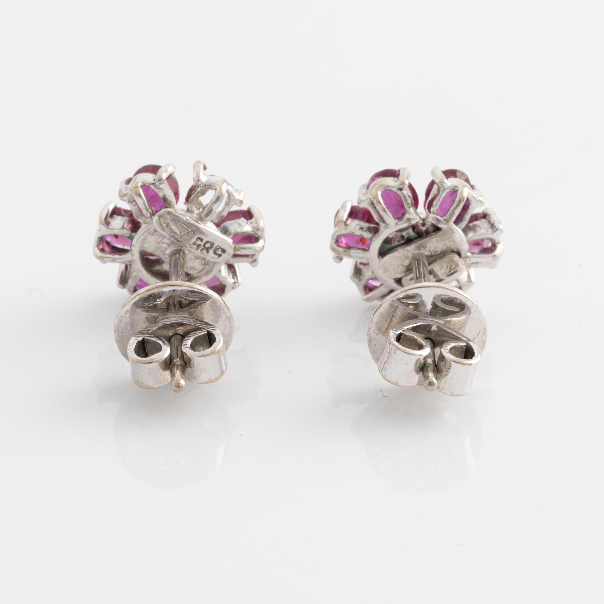 Earrings, one pair, white gold with rubies and small diamonds.