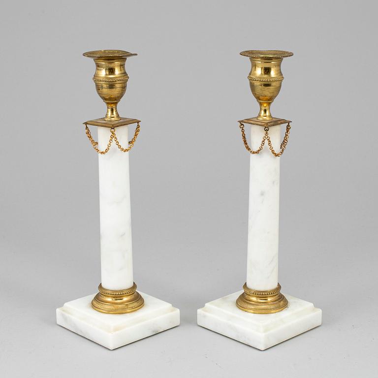 A pair of gustavian style candlesticks, early 20th century.