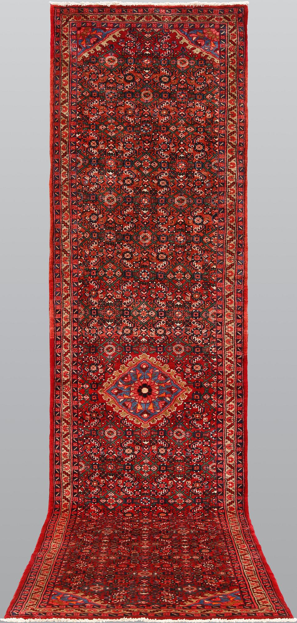 A Hosseinabad runner, ca 427 x 110 cm.