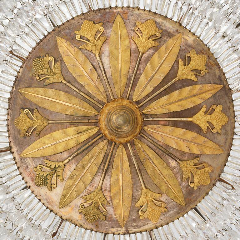 An ormolu and cut glass sixteen-branch Empire chandelier, Paris, early 19th century.