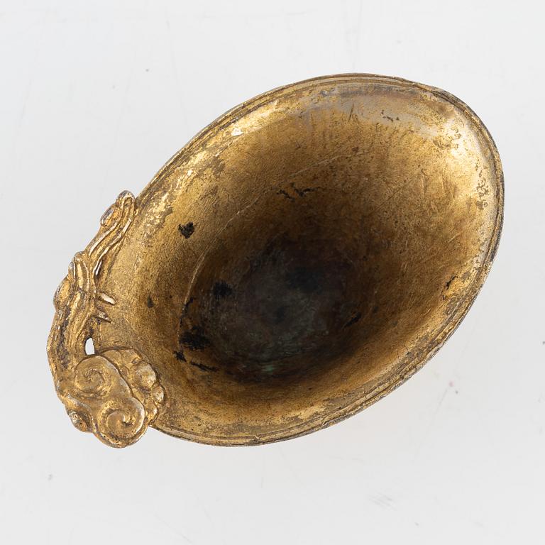 A gilt bronze libation cup, China, presumably 20th Century.