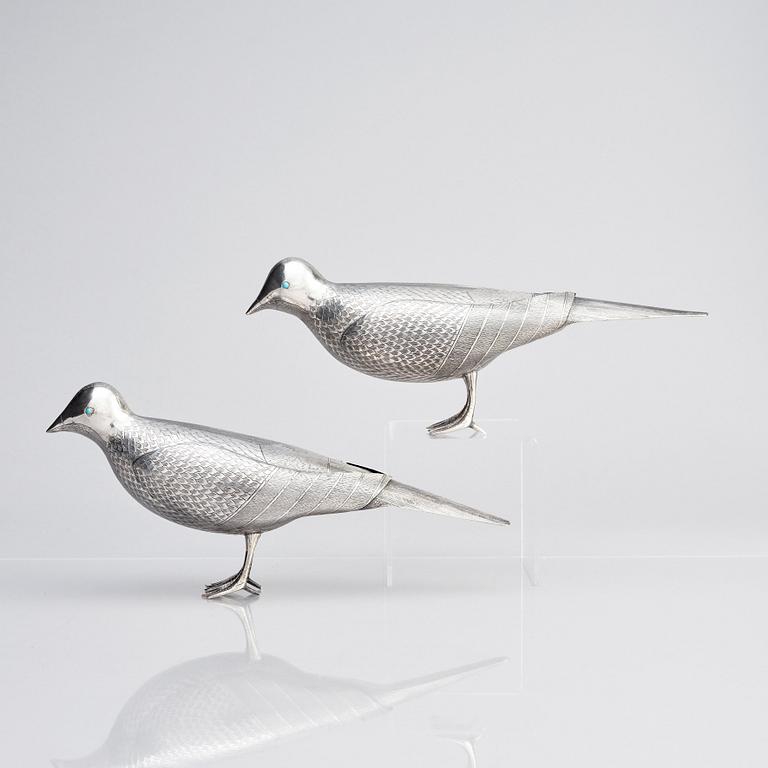 A pair of persian silver pigeons, the Qajar dynasty (1789–1925).