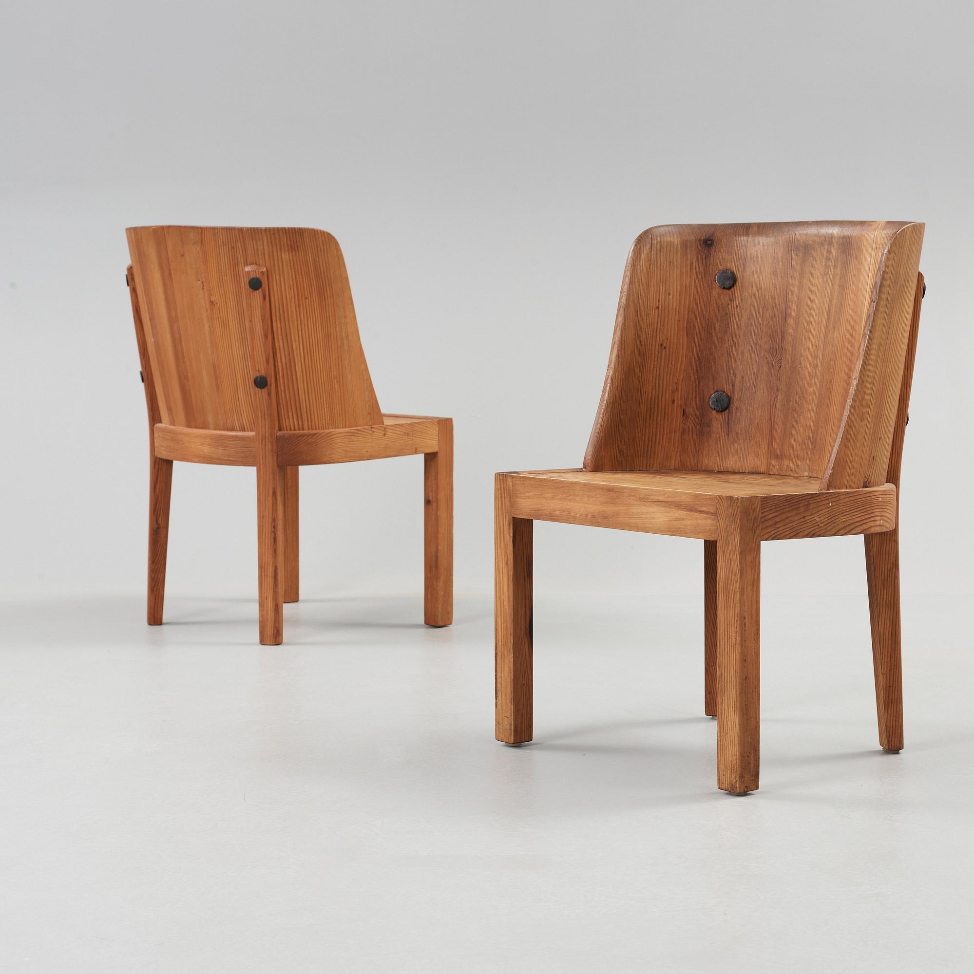 A pair of Axel Einar Hjorth stained pine armchairs, 'Lovö', Nordiska Kompaniet, 1930's.