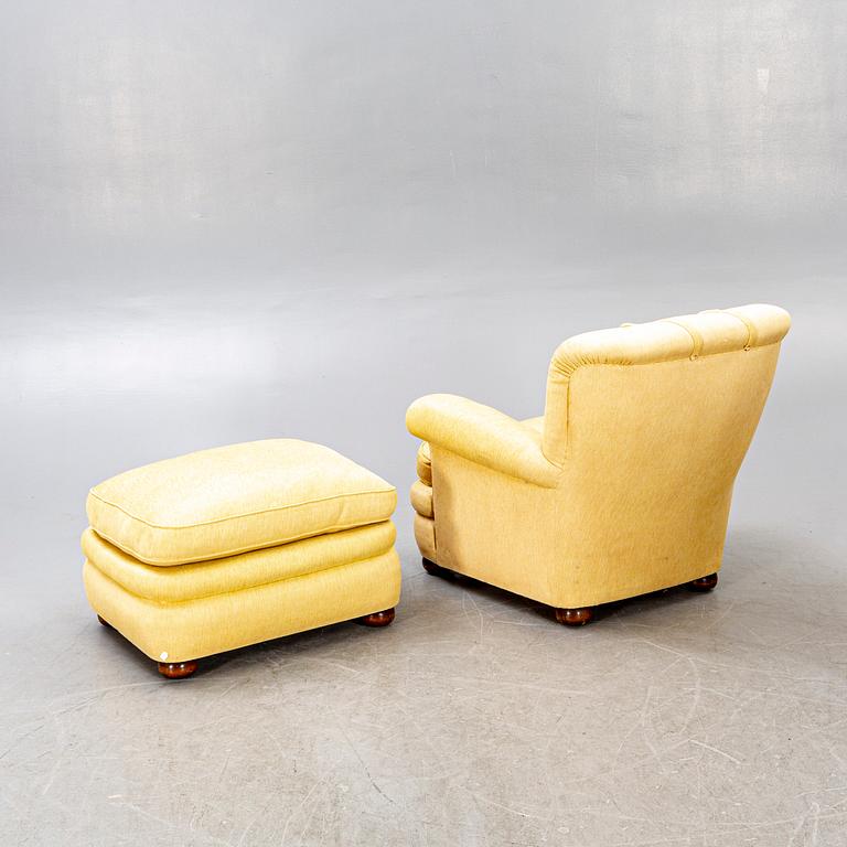 A model 336 lounge chair with foot stool by Josef Frank for Firma Svenskt Tenn, designed in 1934.