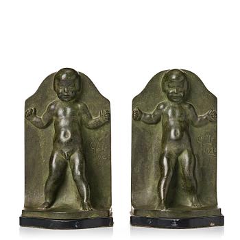 279. Axel Gute, a pair of green patinated metal bookends, Sweden, dated 1920.