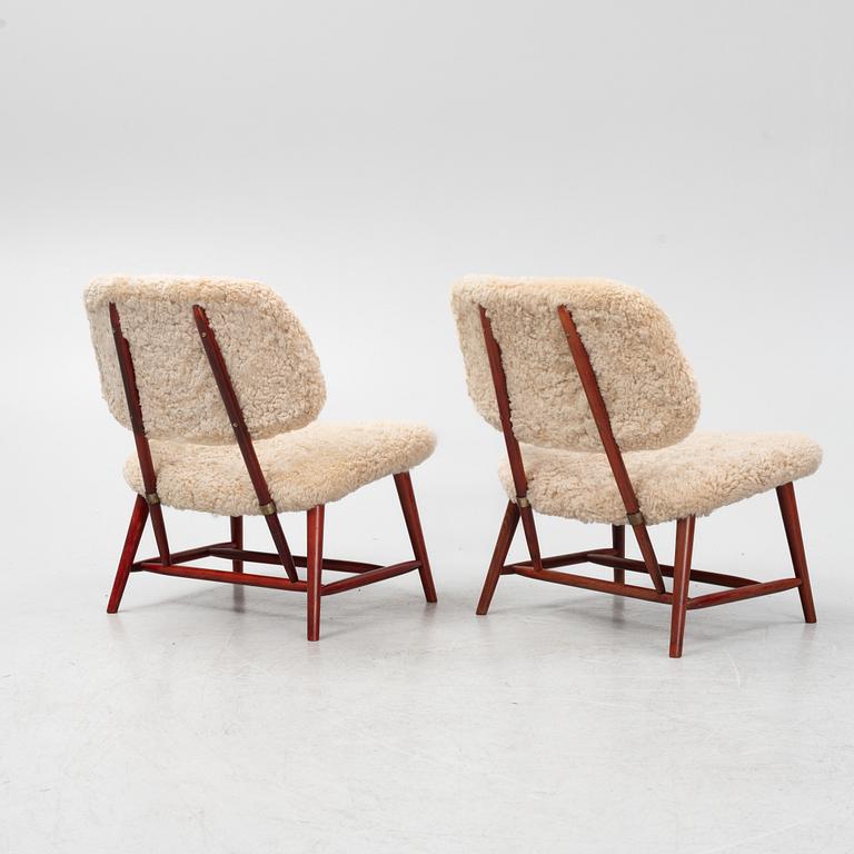 Alf Svensson, a pair of 'TeVe' easy chairs with new sheepskin upholstery, 1950s.