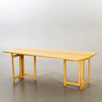 A pine wood gated leg table, design by Olof Pira "Sold Form".