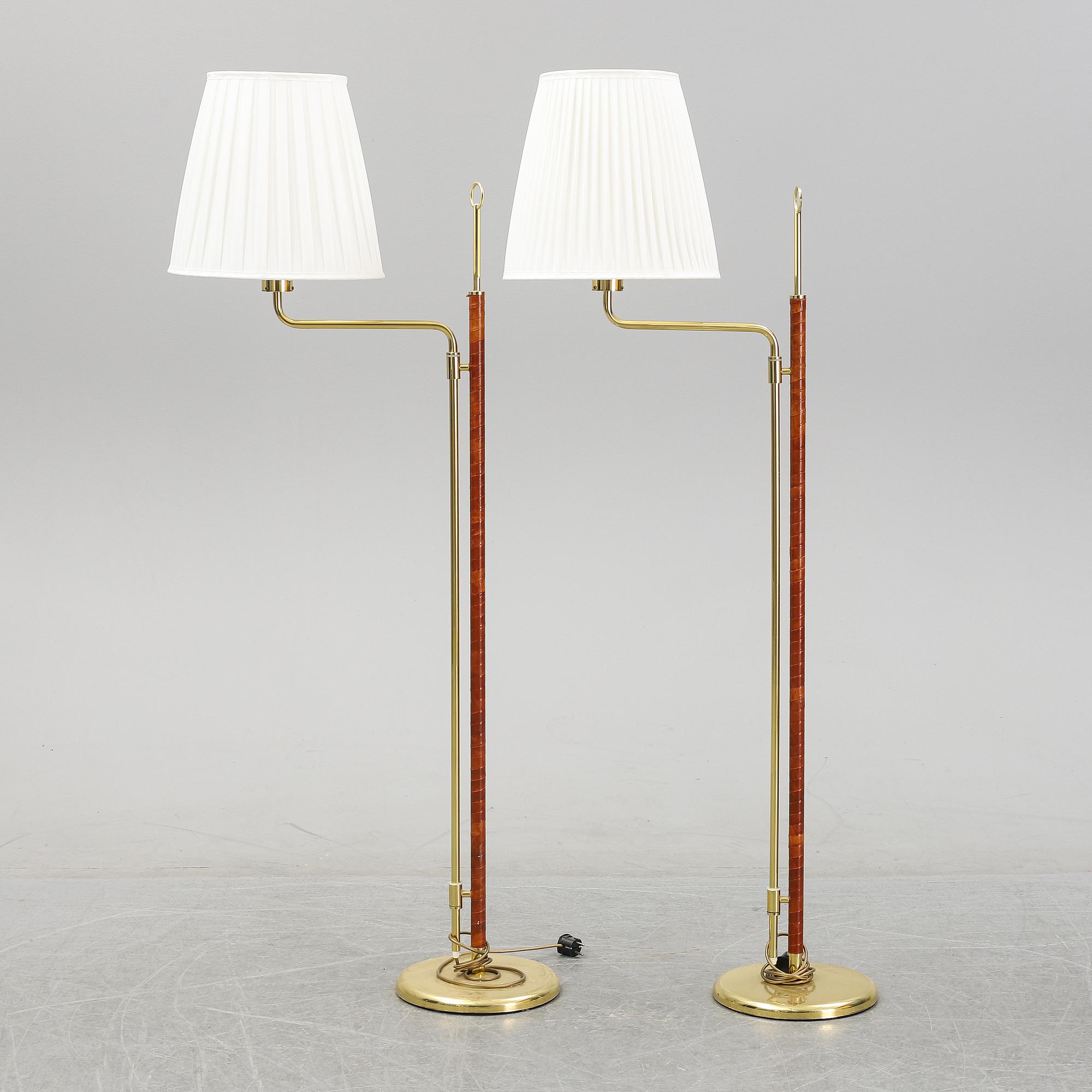 A pair of brass and leather floor lamps, Örsjö Designe, 21st century.