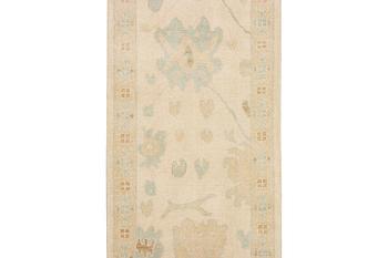 An Ushak runner carpet, c. 360 x 80 cm.