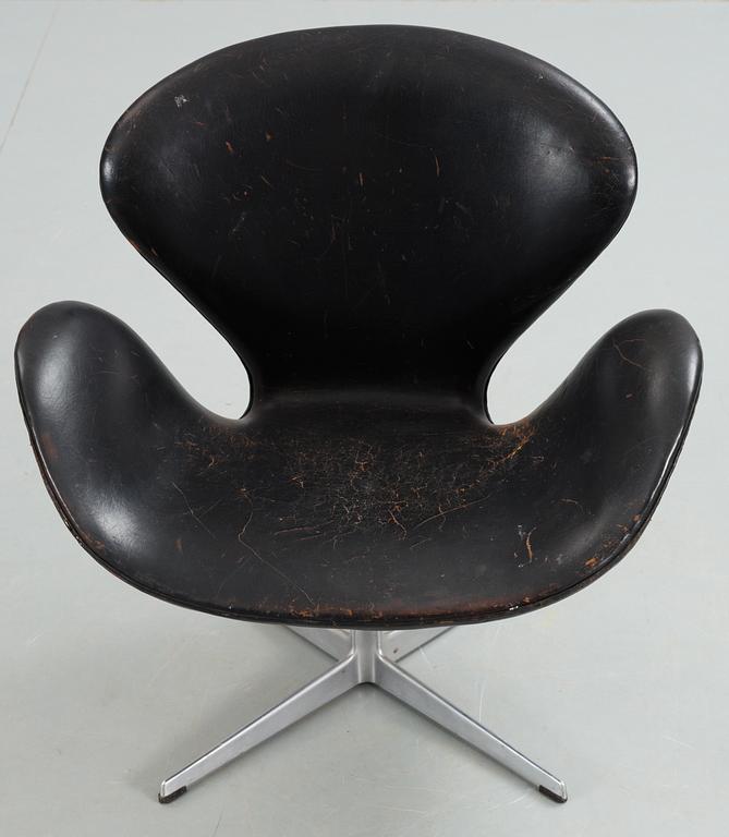 An Arne Jacobsen black leather 'Swan' easy chair, Fritz Hansen, Denmark 1960's.