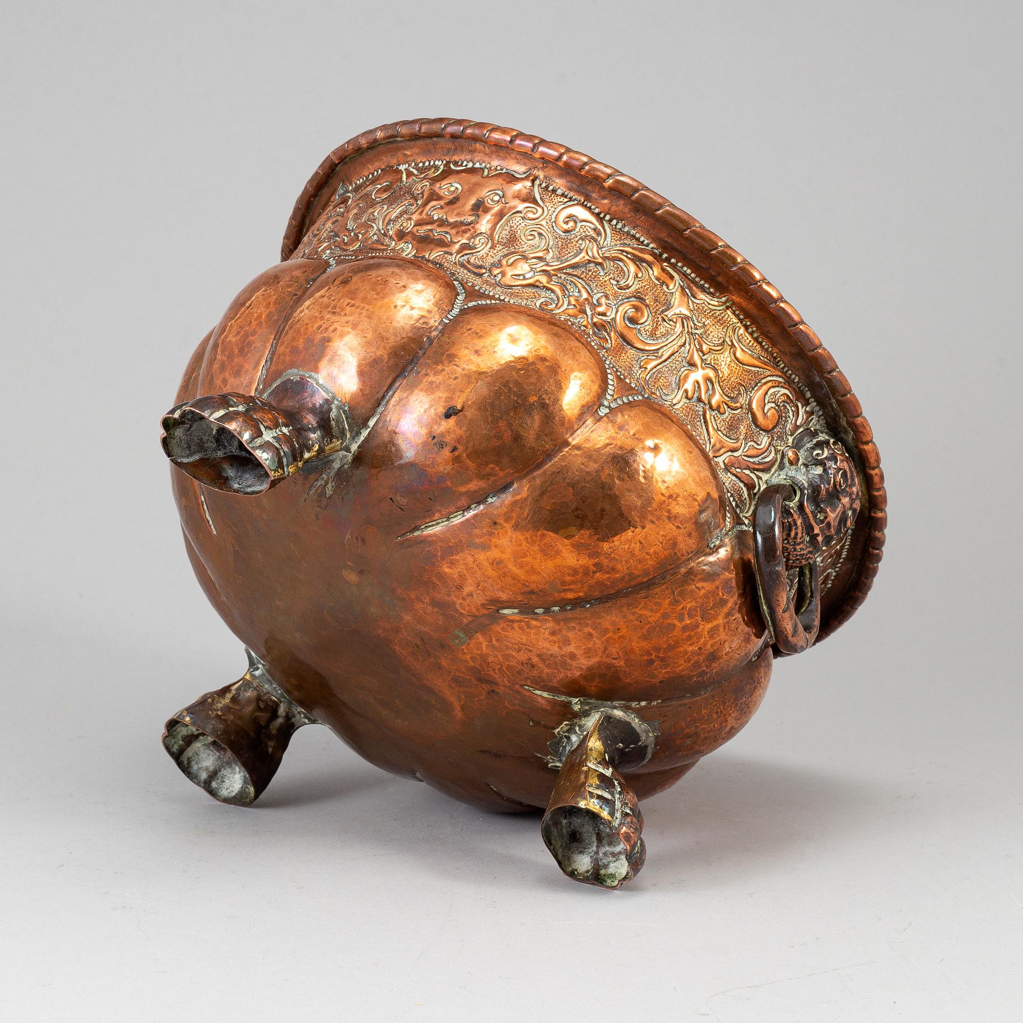 A 19th century copper champagne cooler.