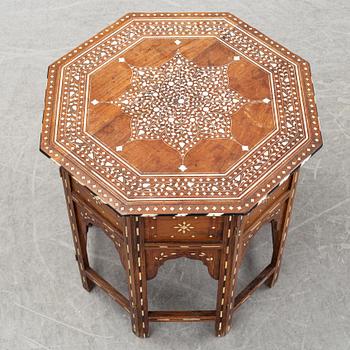 A Middle-Eastern occasional table and armchair, 20th Century.