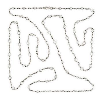 574. An antique platinum diamond long chain.