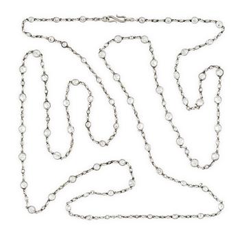 574. An antique platinum diamond long chain.