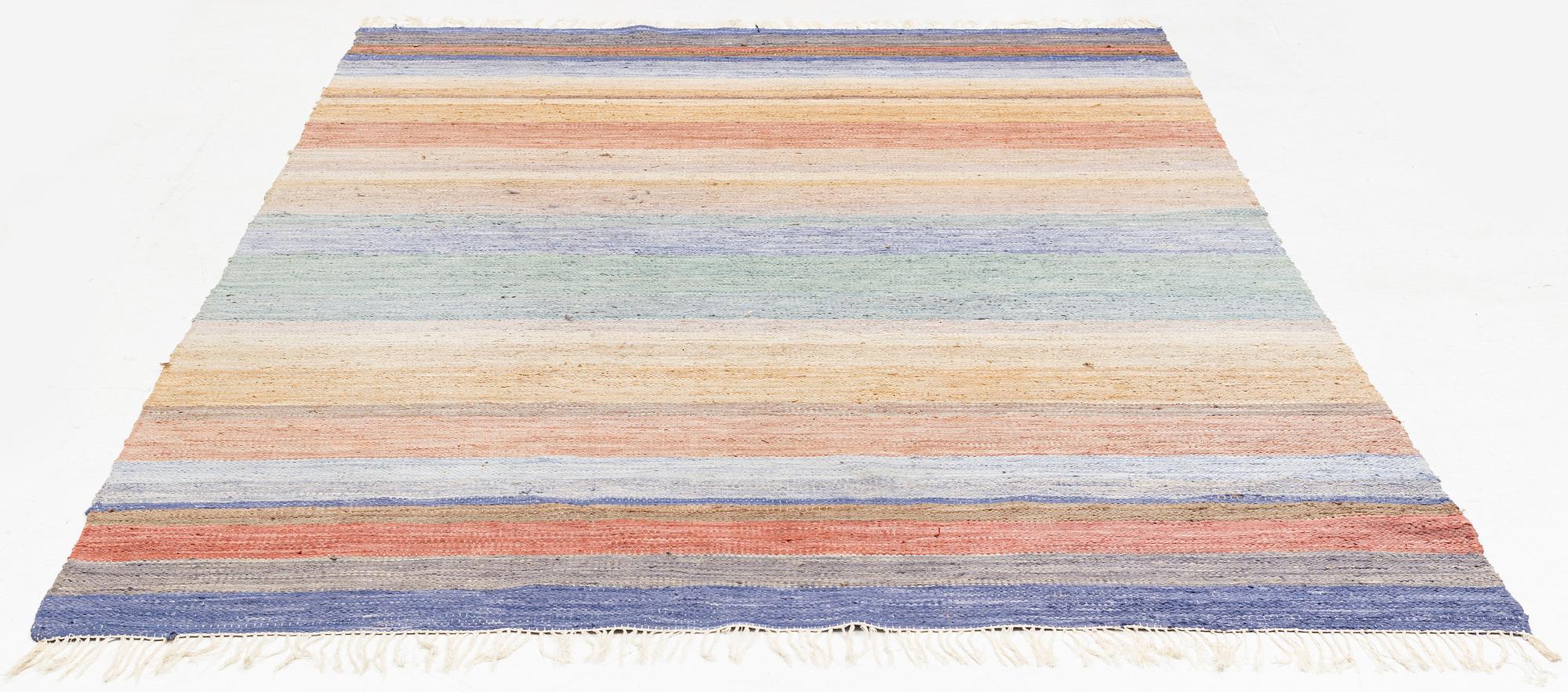 A rag rug, c. 300 x 195 cm.