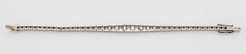 A platinum bracelet set with round brilliant-cut diamonds.