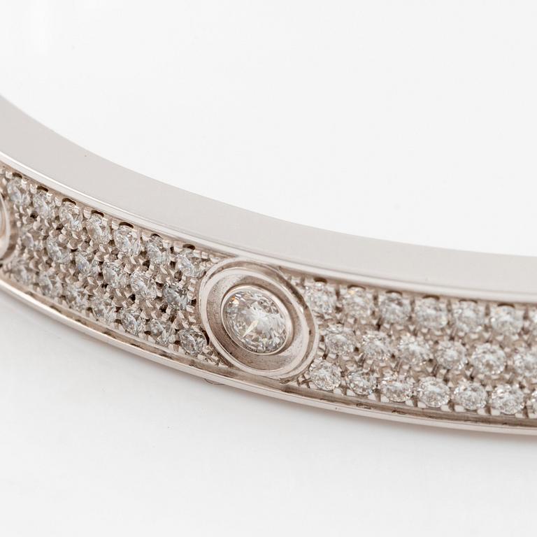 A Cartier "Love" bracelet in 18K white gold set with round brilliant-cut diamonds.