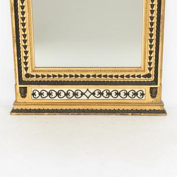 A Swedish Empire giltwood and bronzed mirror attributed to Jonas Frisk (master in Stockholm 1805-24).