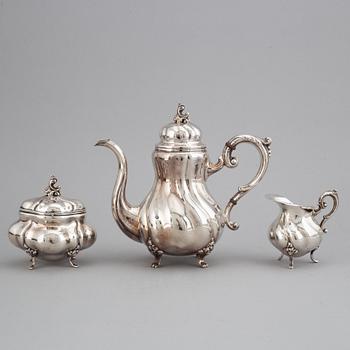 A silver coffee pot, creamer and sugar bowl. Swedish import marks.