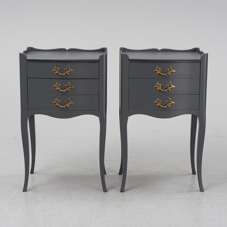 A pair of rococo style bedside tables.