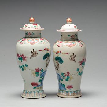 A pair of famille rose vases with covers, Qing dynasty, Qianlong (1736-95).