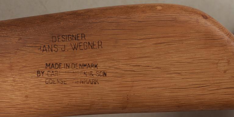 A pair of Hans J Wegner oak and rattan 'CH-27' armchairs, Carl Hansen & Son, Denmark, 1950's-60's.