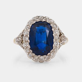 A 7.60 ct unheated sapphire and diamond cluster ring. Certoificate from SSEF.