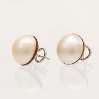 A pair of 18K white gold earrings set with Mabe pearls, Hans Strömdahl Stockholm 1989.