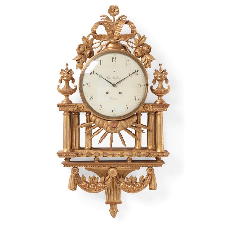 A Gustavian giltwood cartel clock by H. Wessman (watchmaker in Stockholm 1787-1805).